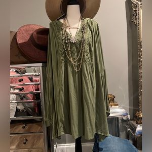 This pastel green peasant  flowing V-neck, this top  with crocheted sides